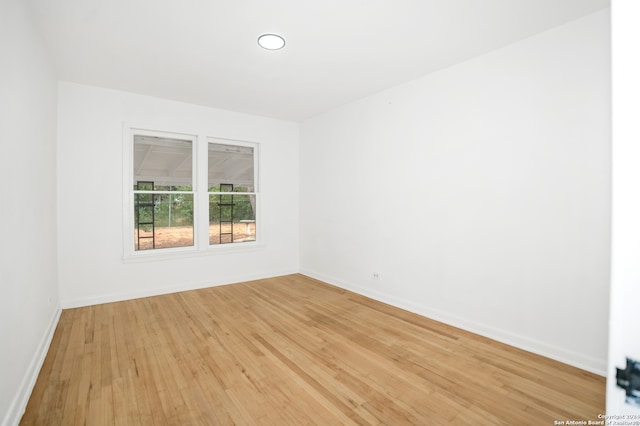 spare room featuring light wood-type flooring