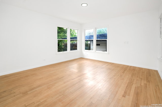 unfurnished room featuring light hardwood / wood-style floors