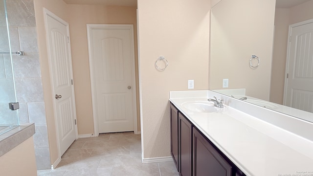 bathroom with vanity and tile patterned flooring