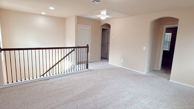 empty room featuring light colored carpet