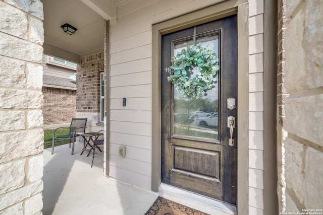 entrance to property with covered porch