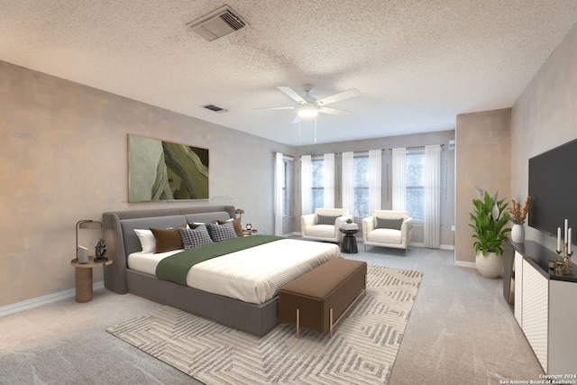 bedroom featuring ceiling fan, a textured ceiling, and light carpet