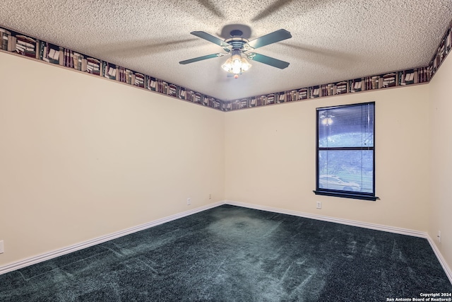 empty room with a textured ceiling, ceiling fan, and dark carpet