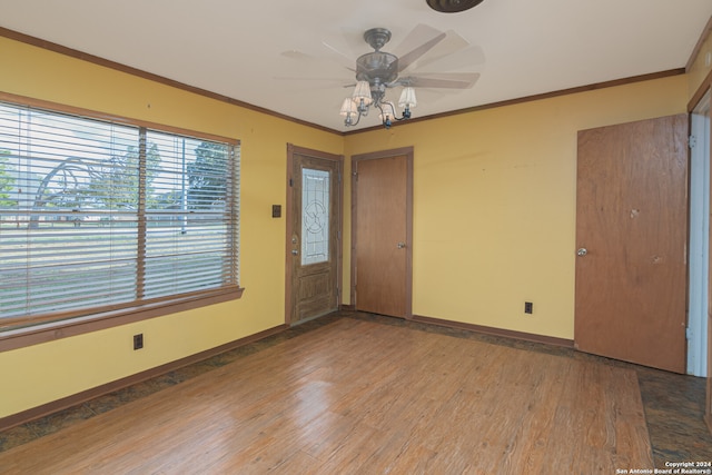 foyer featuring hardwood / wood-style floors, ceiling fan, and crown molding