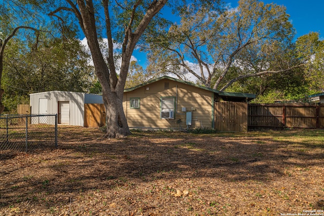 exterior space featuring an outbuilding and cooling unit