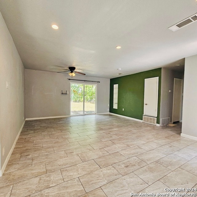 unfurnished room with ceiling fan