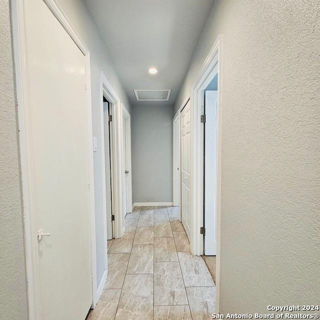 3023 Greenacres St, San Antonio, TX 78230 - hallway featuring recessed lighting