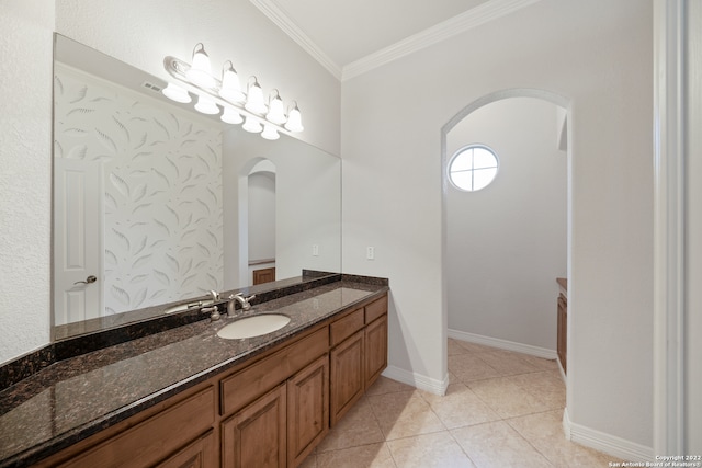 bathroom featuring vanity, tile patterned floors, and crown molding