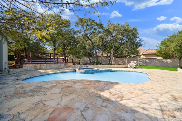 view of swimming pool featuring a patio area