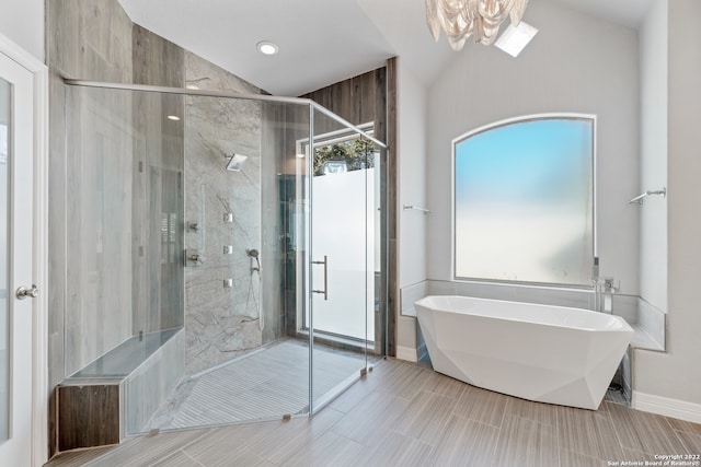 bathroom with independent shower and bath and lofted ceiling