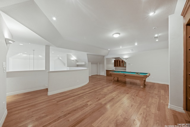 recreation room featuring lofted ceiling, light hardwood / wood-style floors, and billiards