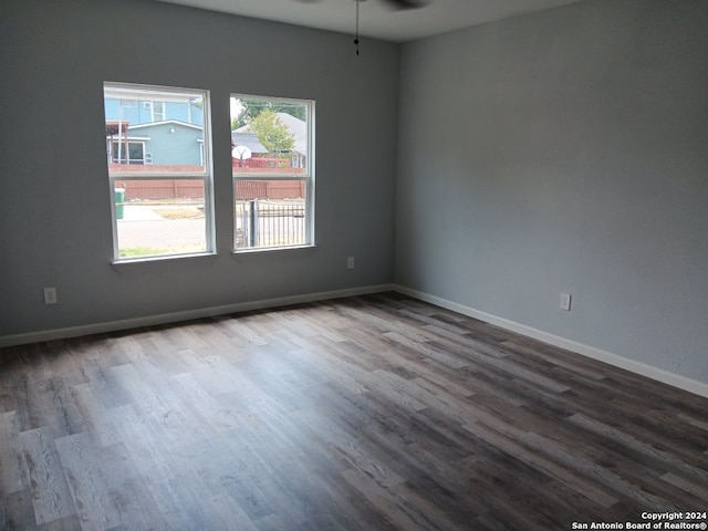 empty room with hardwood / wood-style flooring and ceiling fan