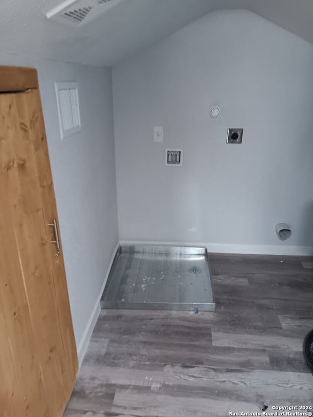 clothes washing area featuring hookup for an electric dryer and wood-type flooring