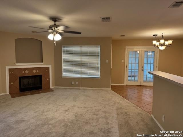 5306 Stormy Breeze, San Antonio, TX 78247 - unfurnished living room featuring tile patterned flooring, carpet, a ceiling fan, french doors, and healthy amount of natural light