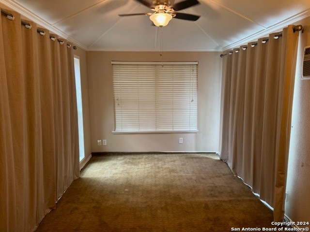 unfurnished room featuring vaulted ceiling, ceiling fan, crown molding, and carpet floors