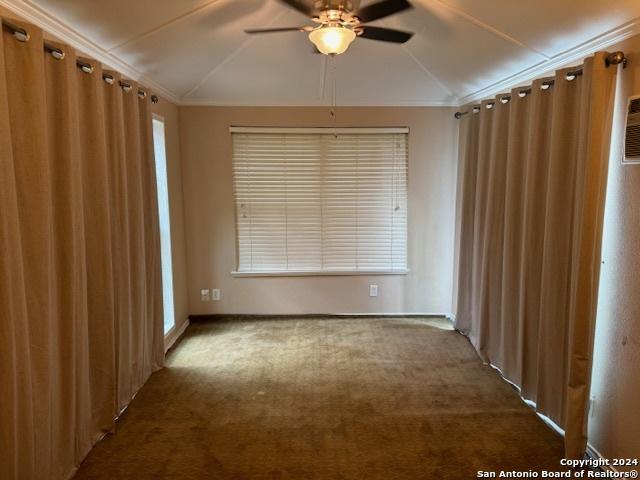 5306 Stormy Breeze, San Antonio, TX 78247 - unfurnished room featuring lofted ceiling, ceiling fan, carpet flooring, crown molding, and healthy amount of natural light