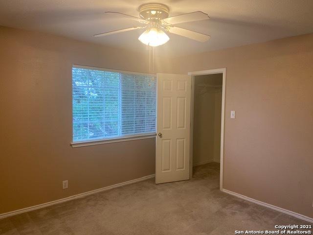5306 Stormy Breeze, San Antonio, TX 78247 - unfurnished room featuring a ceiling fan, carpet flooring, and baseboards