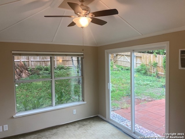 interior space with ceiling fan, light carpet, and ornamental molding