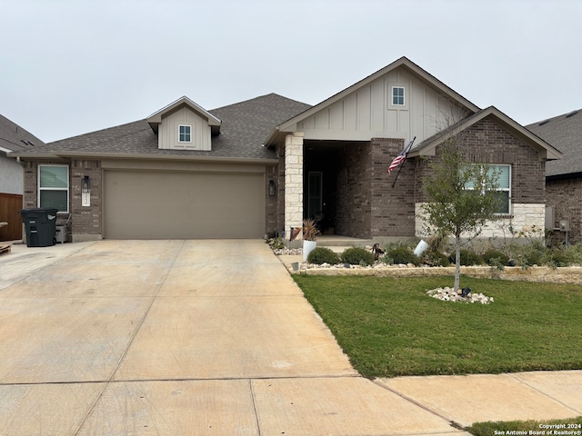 view of front of home with a garage and a front yard