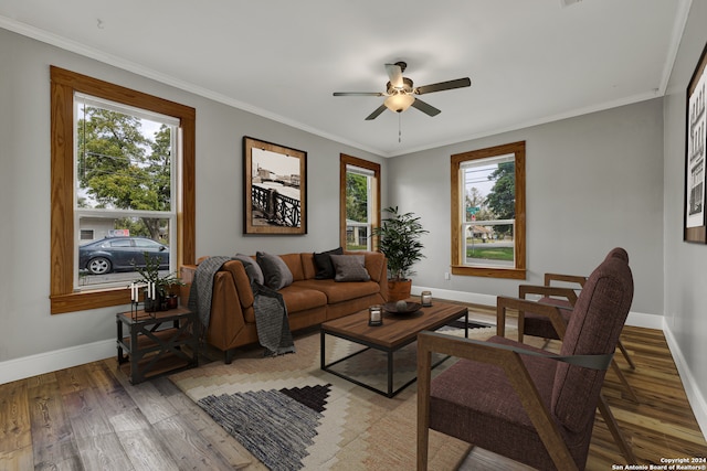 living room featuring ceiling fan, wood-type flooring, and ornamental molding