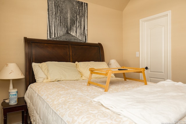 bedroom with vaulted ceiling