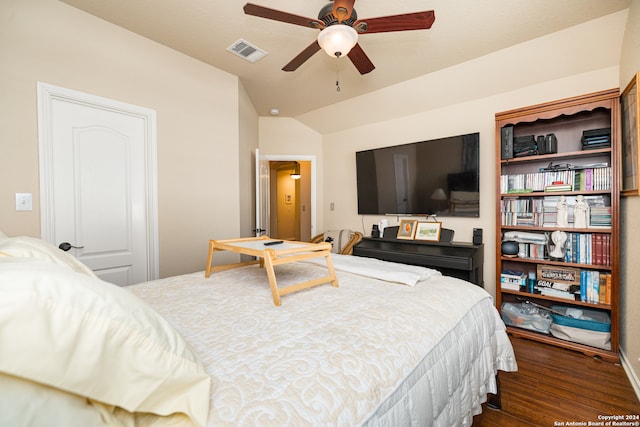 bedroom with dark wood-type flooring, ceiling fan, and lofted ceiling