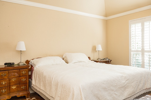 bedroom featuring dark hardwood / wood-style floors and crown molding