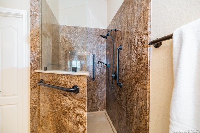 bathroom with a tile shower