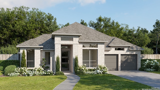 view of front of house with a garage and a front yard