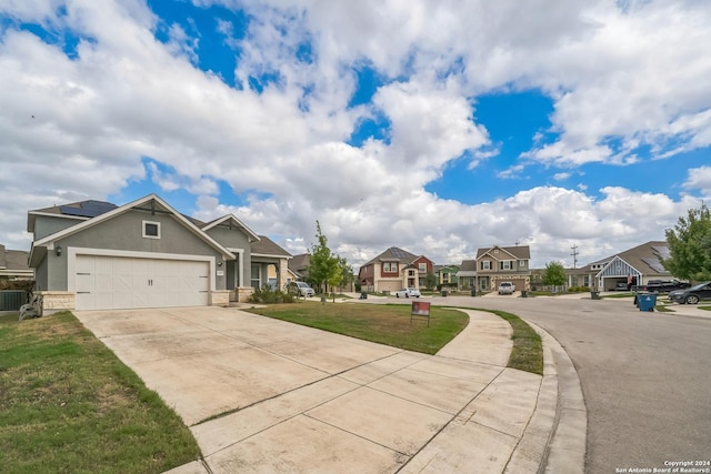 12009 Vignette, Schertz, TX 78154 - view of front of house with a residential view, concrete driveway, a front lawn, and a garage