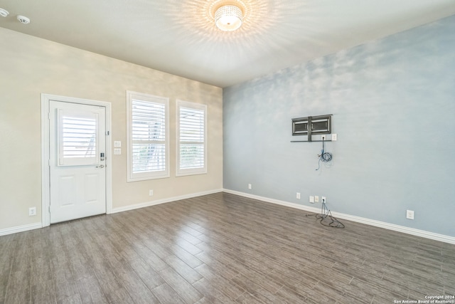 empty room with hardwood / wood-style floors