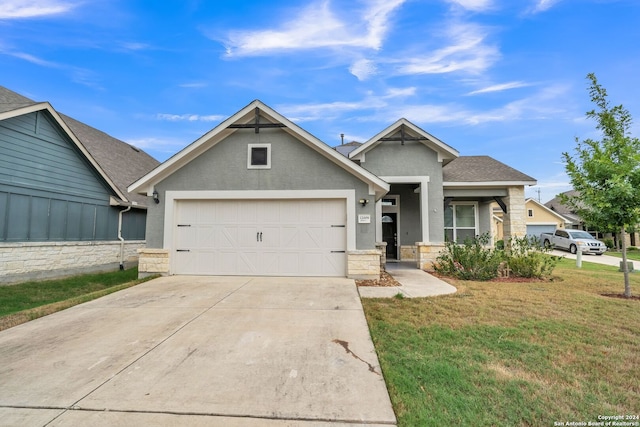 12009 Vignette, Schertz, TX 78154 - view of front of property featuring stone siding, a front lawn, a garage, driveway, and stucco siding