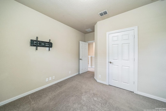 12009 Vignette, Schertz, TX 78154 - unfurnished bedroom with carpet flooring, baseboards, and a textured ceiling