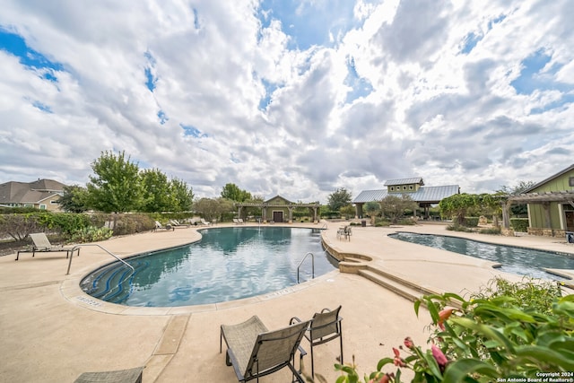 view of pool with a patio