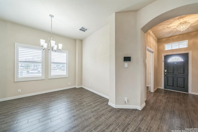 12009 Vignette, Schertz, TX 78154 - foyer entrance featuring a chandelier, arched walkways, dark wood-type flooring, and baseboards