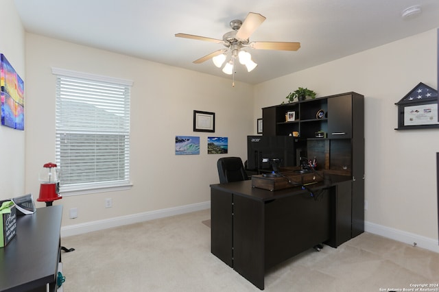 carpeted office with ceiling fan