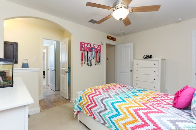 carpeted bedroom with ceiling fan