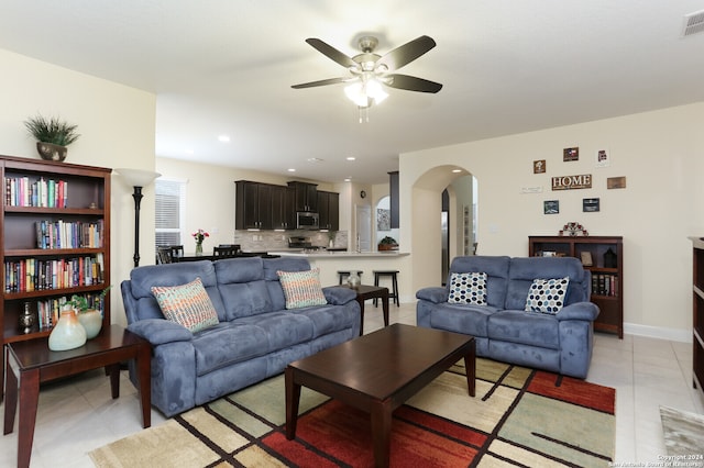 living room featuring ceiling fan and light tile patterned flooring