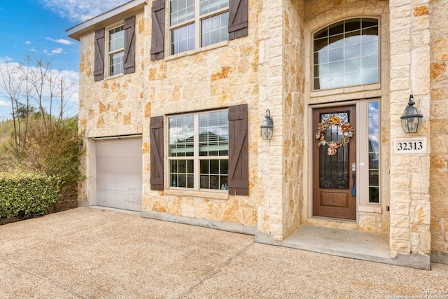 property entrance featuring a garage