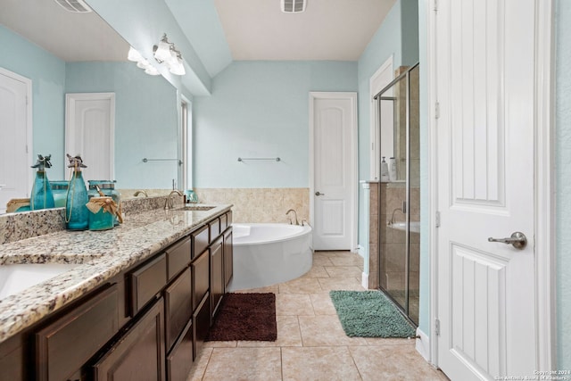 bathroom featuring vanity, tile patterned flooring, plus walk in shower, and vaulted ceiling