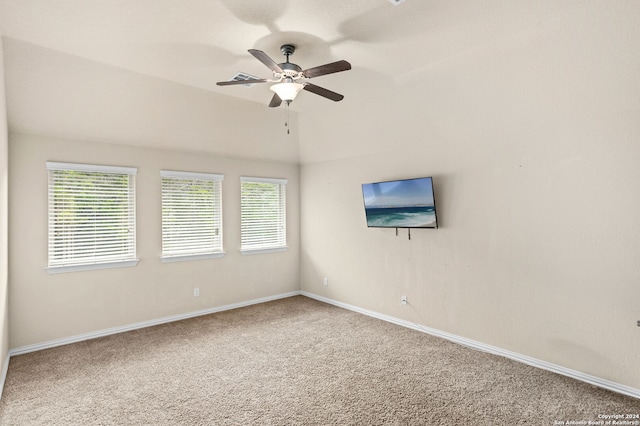 unfurnished room featuring vaulted ceiling, ceiling fan, and carpet floors