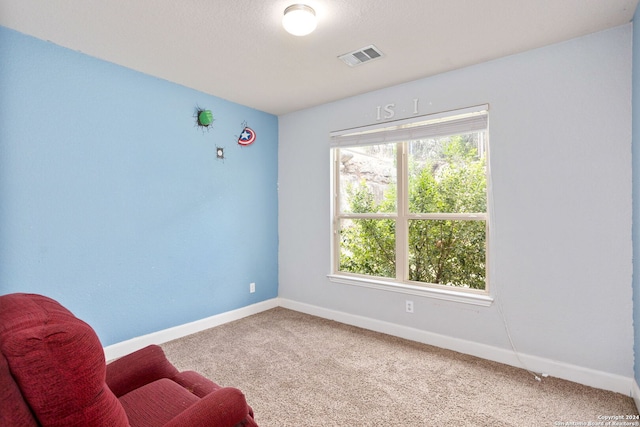 living area with carpet flooring