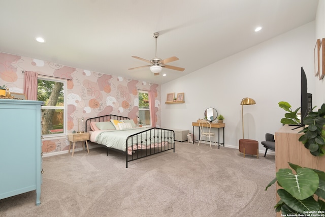 bedroom featuring ceiling fan, carpet flooring, and lofted ceiling