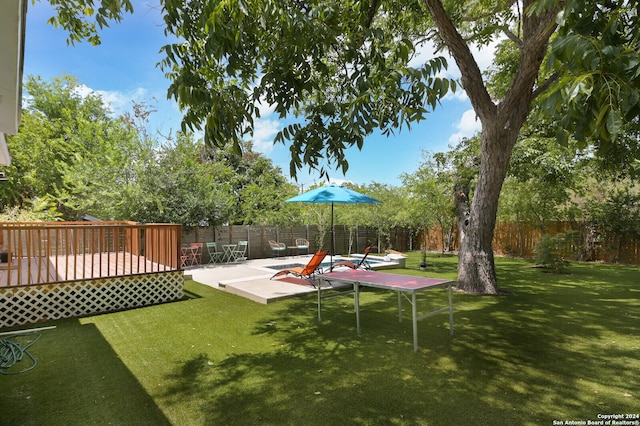 view of yard with a deck and a patio area