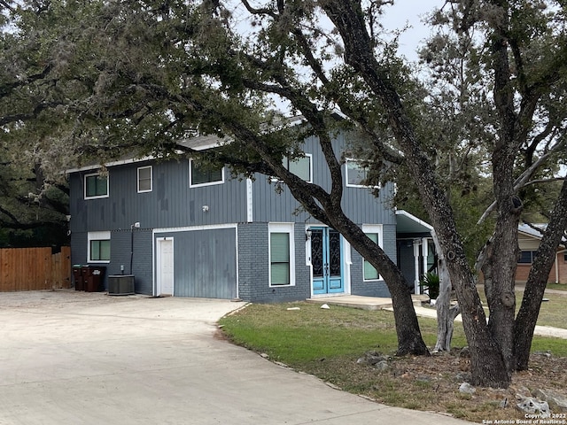 view of side of property with a garage and a yard