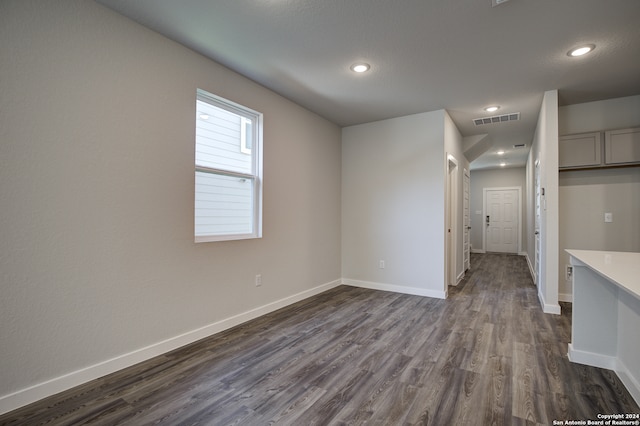 spare room with dark hardwood / wood-style flooring