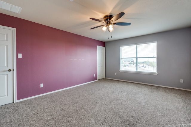 empty room with carpet and ceiling fan