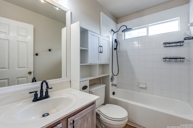 full bathroom with vanity, tiled shower / bath combo, and toilet