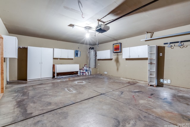 garage featuring water heater and a garage door opener