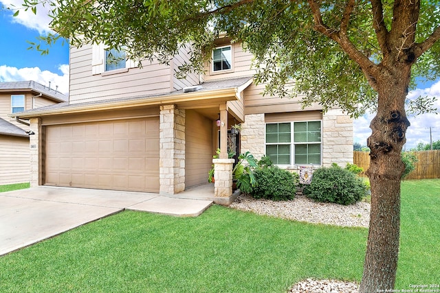 view of front facade featuring a garage and a front yard